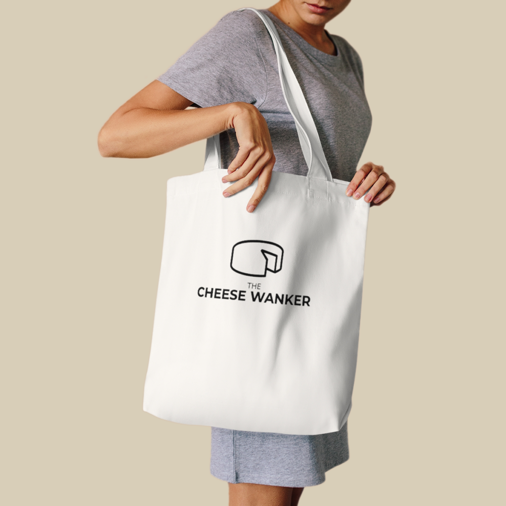 Female cheese lover carrying our The Cheese Wanker Logo Market Bag