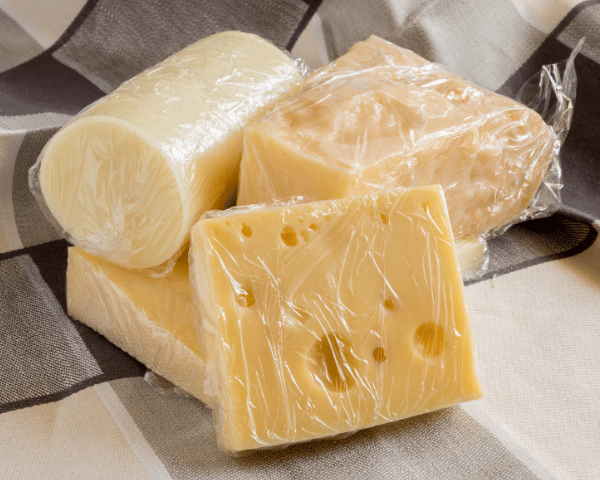 hard cheeses wrapped in plastic cling wrap