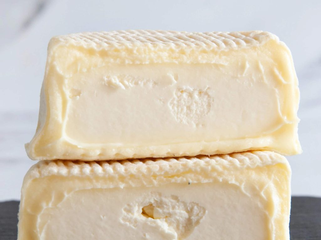 Soft white mould Cremont cheese cut in half