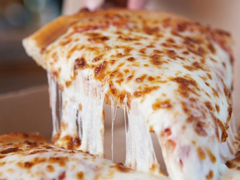 stretchy mozzarella on a slice of pizza