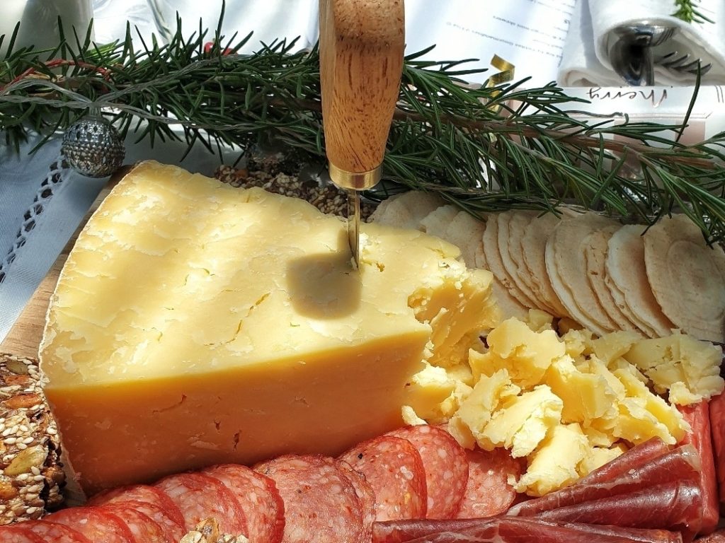Chunk of Montgomery Cheddar on Christmas Cheese Platter