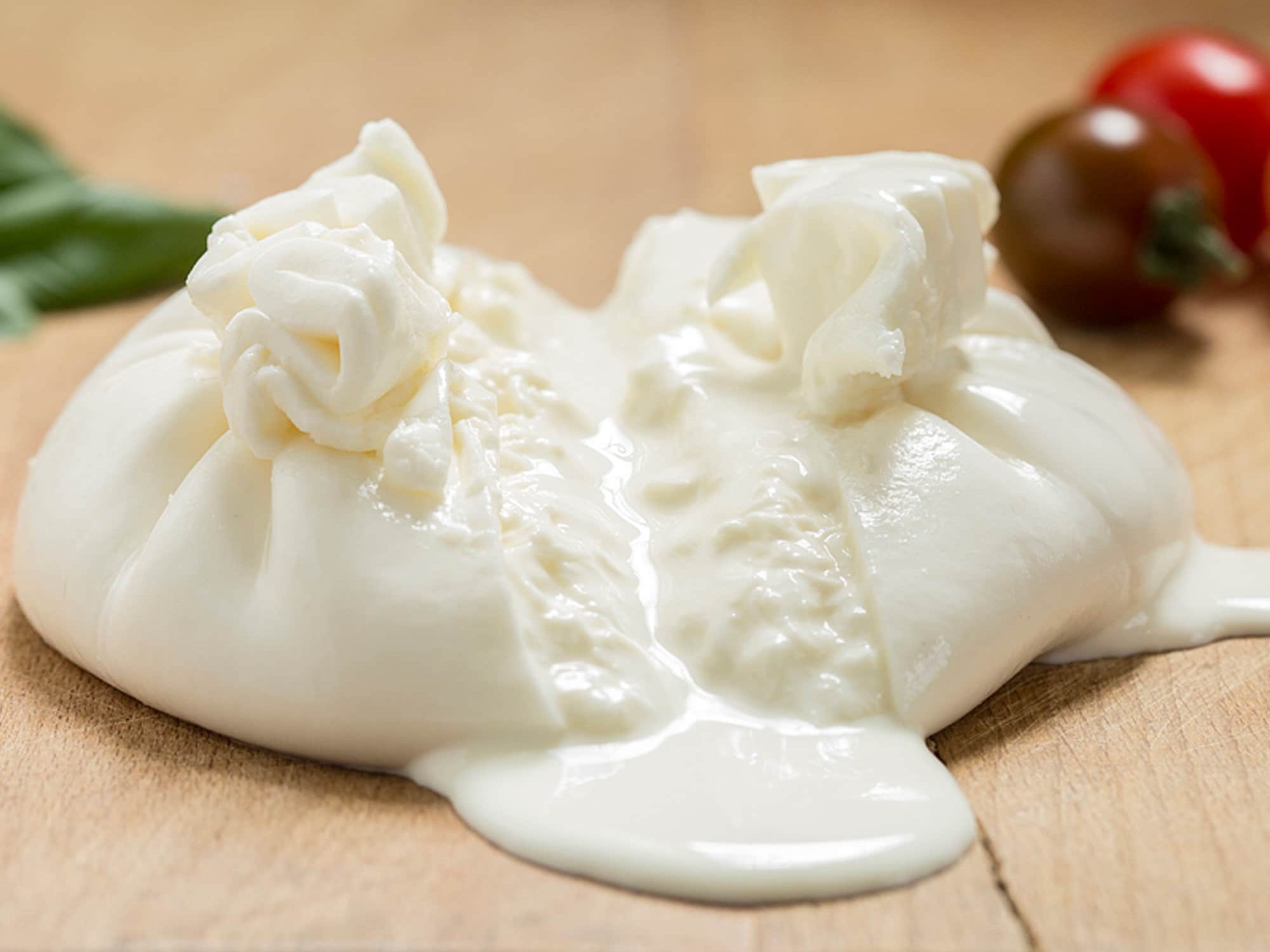 Italian Burrata cheese cut in half to show creamy insides