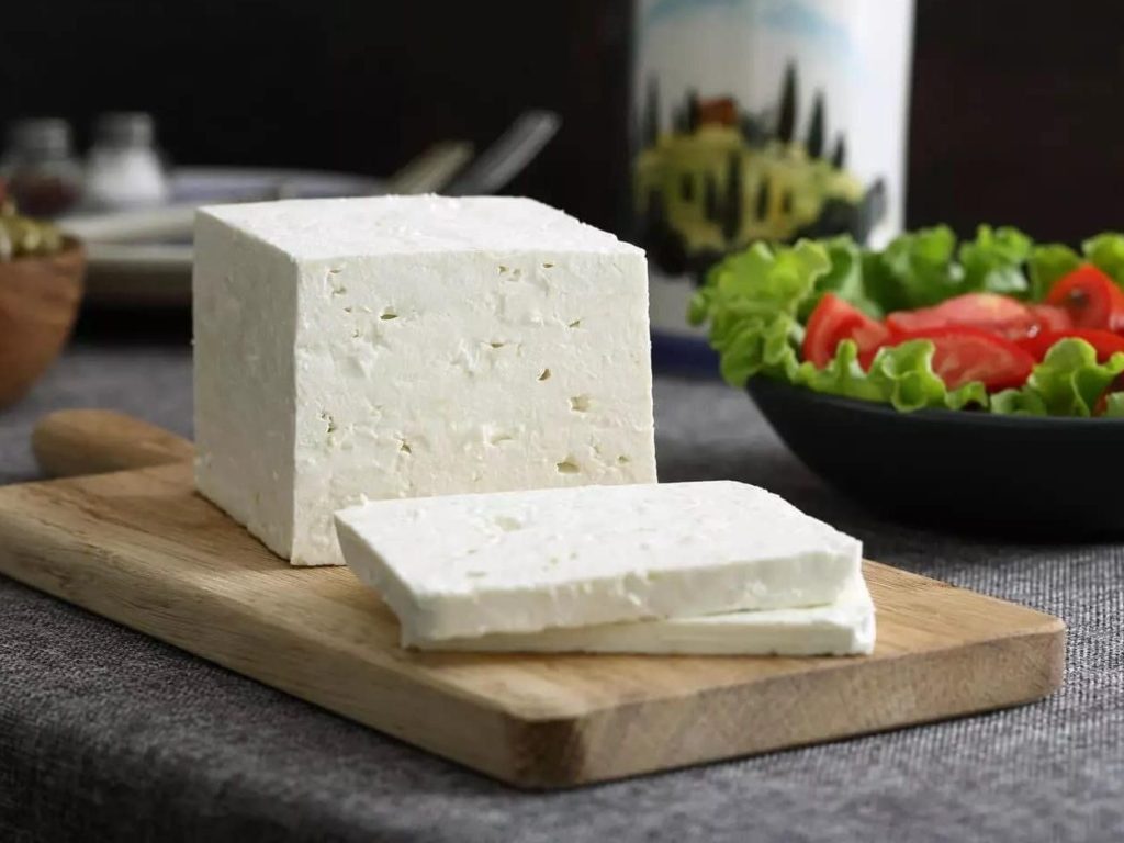 Block of feta on cheese board - 5 healthiest types of cheese