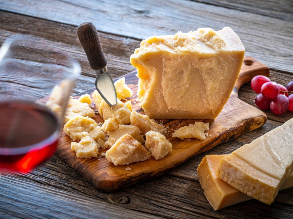 Parmigiano Reggiano wedge on a chopping board