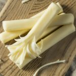 Commercial String Cheese on a wooden board