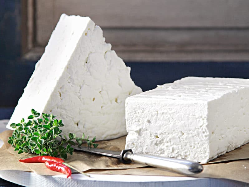 White Sfela Greek PDO cheese on chopping board