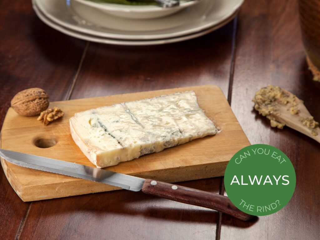 Slice of Gorgonzola blue cheese on cheese board