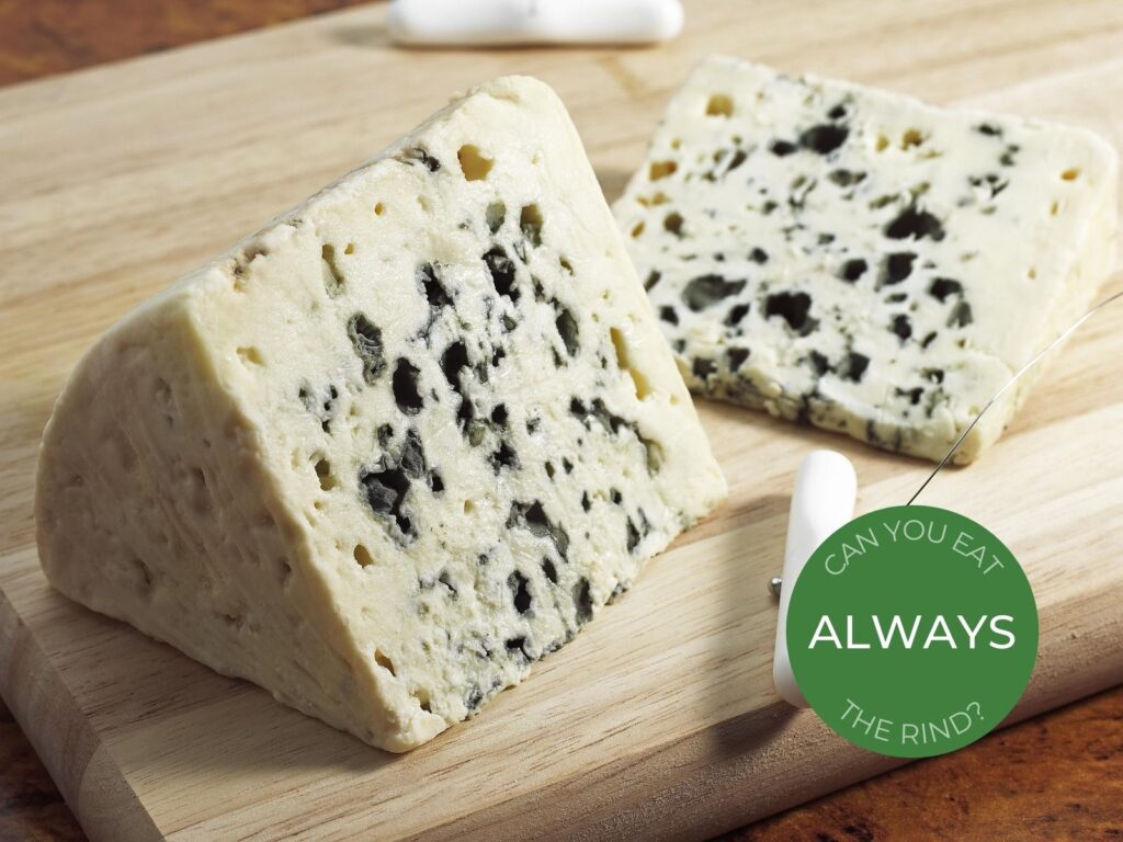 Piece of Roquefort blue cheese on wooden board