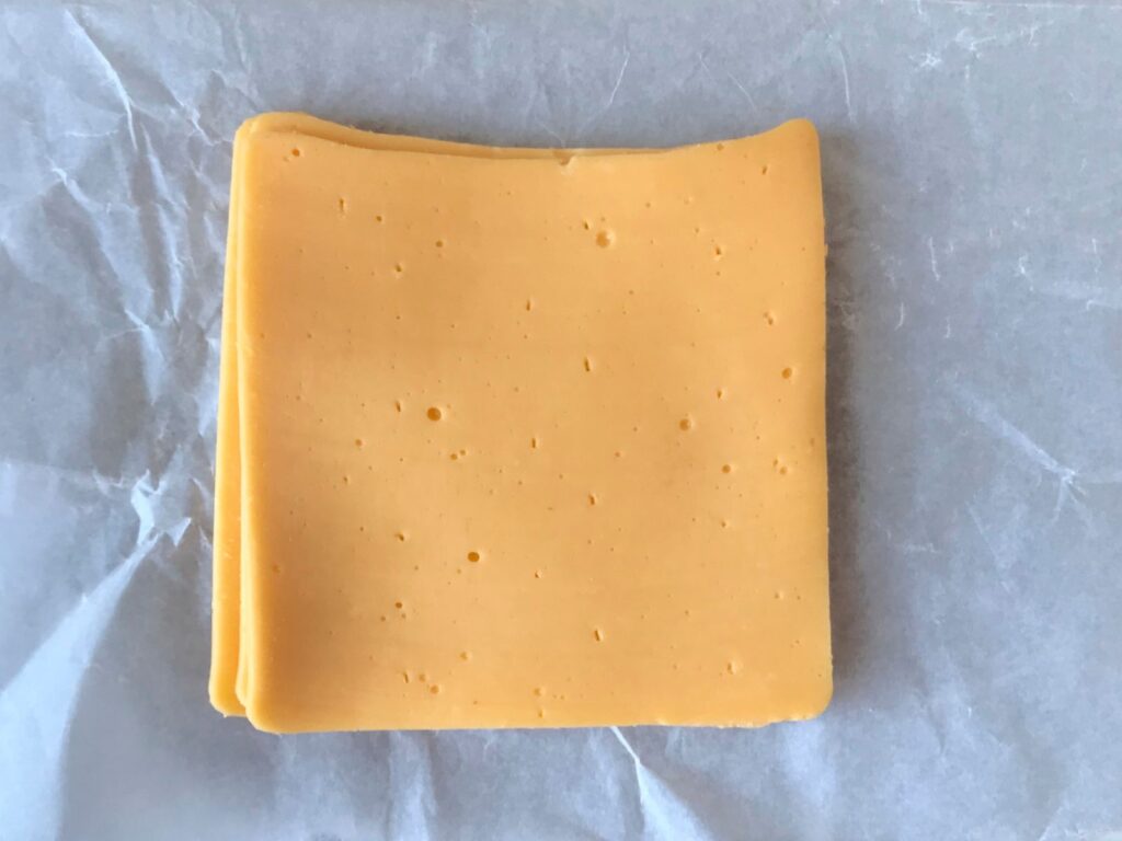 Slices of American Cheese on paper