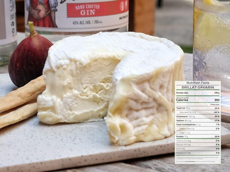 Small format creamy Brillat-Savarin cheese with a wedge cut out next to gin bottle with nutrition facts overlaid