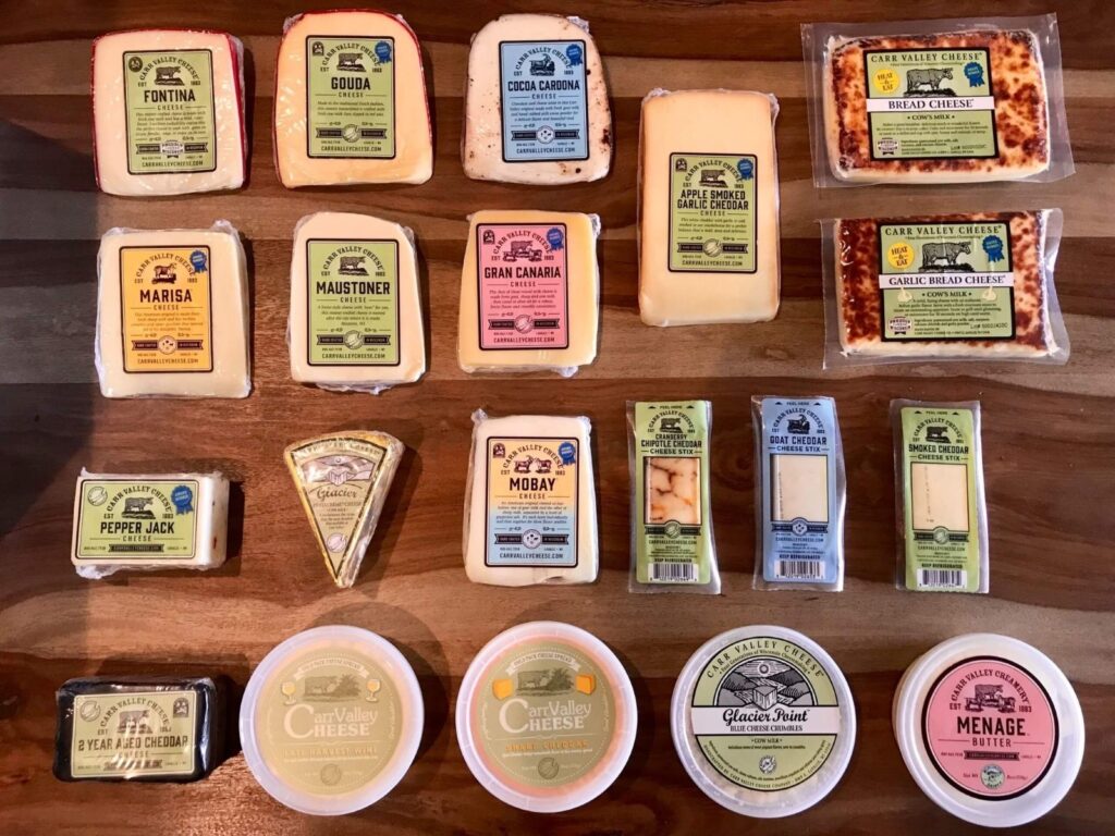 Carr Valley Cheese selection spread out on a wooden table